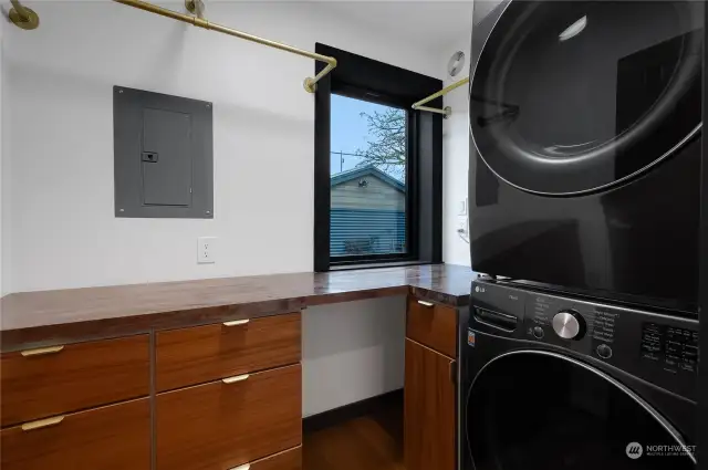 Utility room with stacking washer/dryer.