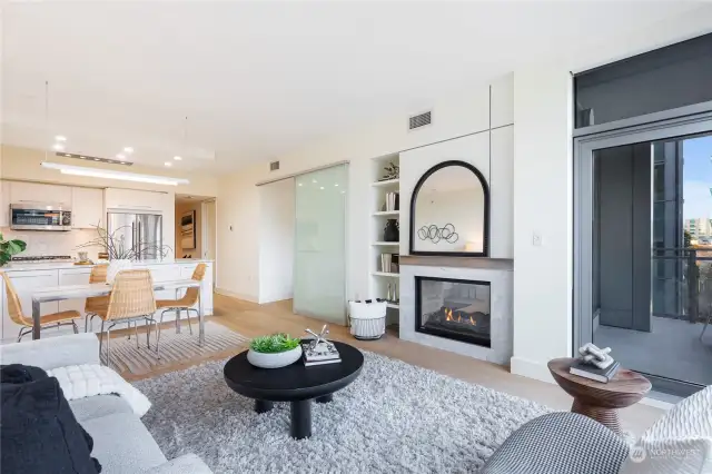 Custom lighting throughout. Note light soffits, double-sided Carrara marble fireplace, great built-ins, etc.