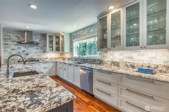 Kitchen was remodeled in 2021. Note prep sink, new appliances and glass faced cabinets