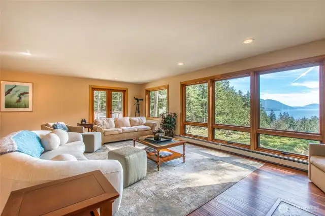 Living room is comfortable, spacious and enjoys spectacular views of Orcas, Entrance Mt and Blakley Island