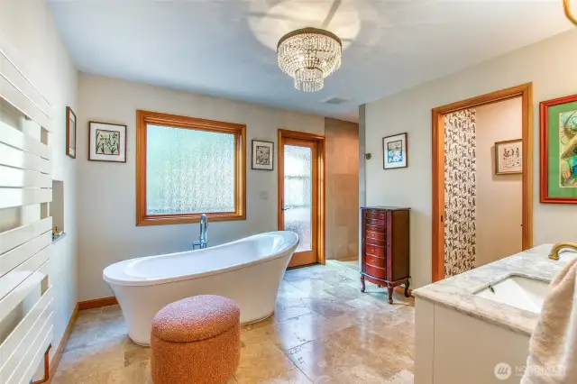 The primary bath is an elgant escape to unwind, start or end your day