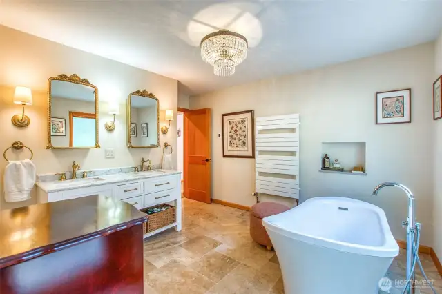 Soaking tub, dual sinks, walk-in shower, warming wall heater and generous storage space highlight the primary bath