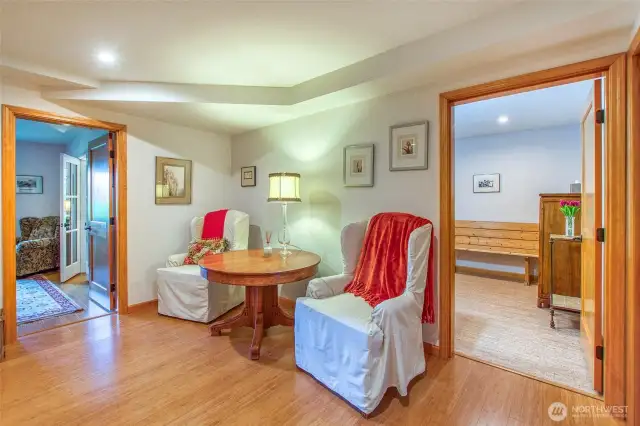 This is a sitting area on the lower floor off the studio/office room. The guest bath is through the door to the right where there is also an exterior door