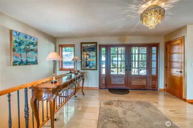 Entry to 192 Osprey. Stairs to left to the lower floor. Open concept is bright and welcoming