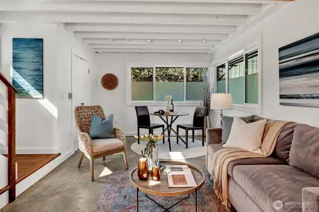 The design uses lots of windows and glass doors to boost natural light and help connect interior spaces seamlessly to the outdoors.  The customized frosted glazing lets the light pour in without sacrificing personal privacy.