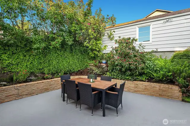 Exterior patio surrounded by plantings