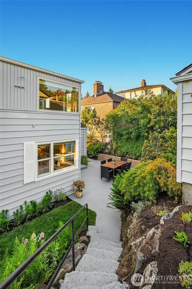 From patio to detached garage in alley.