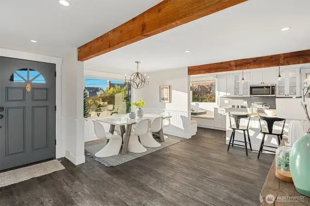 Front entry with open dining area and kitchen. Beautiful exposed beams.