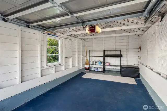 Detached garage interior on alley.