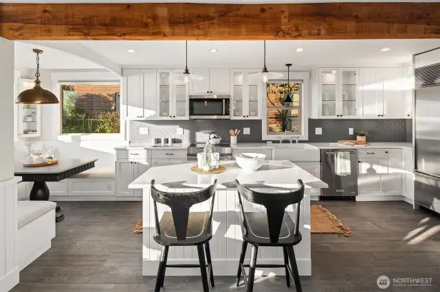 Open updated kitchen with seating options in addition to dining area. Notice breakfast nook on left.