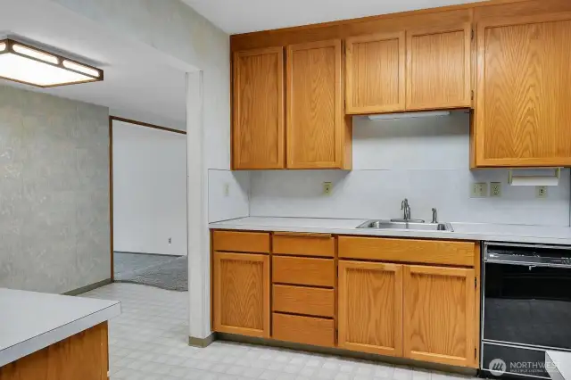 kitchen has loads of cupboards and storage.