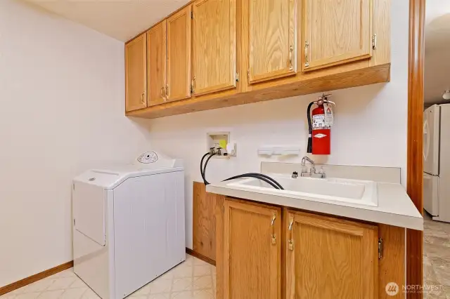 Big utility room with a nice deep sink. Dryer stays.