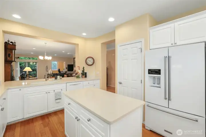Kitchen bar opens to ding area