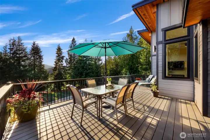 Main Floor partially covered front decking off kitchen with cooling "misters" and amazing territorial views