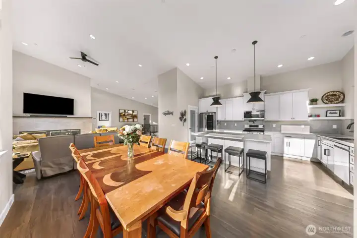 Open concept with dining and living room flooded with light