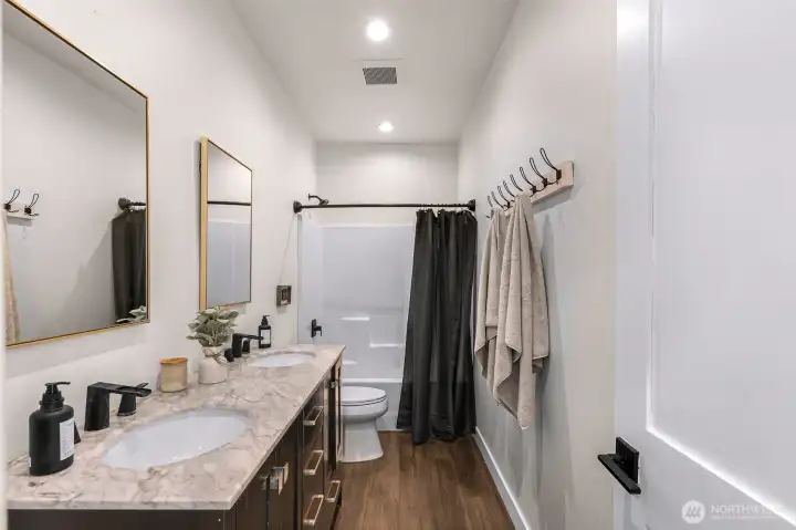 Down stairs full bathroom with dual sink vanity