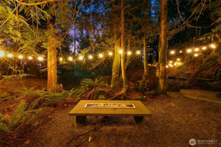 Monolith Chuckanut sandstone :Grotto" with tables and chairs, lighting and fire pits
