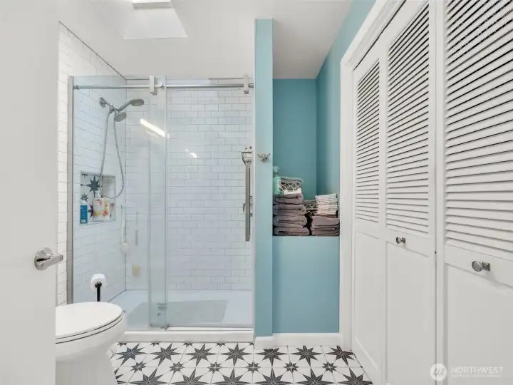 Bath with walk in shower.