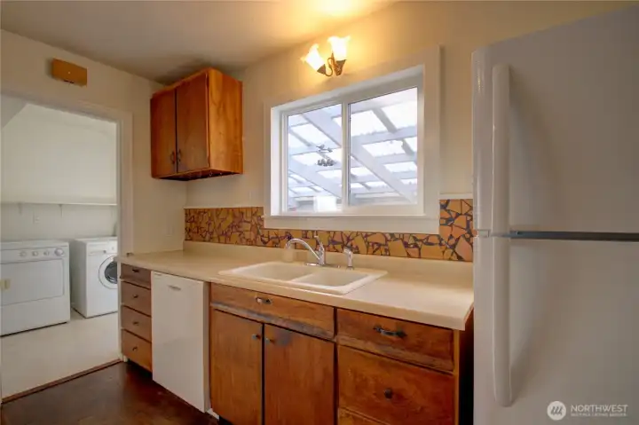 The utility room is at the back door.