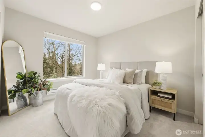 Comfortable secondary bedroom with bright windows and versatile layout