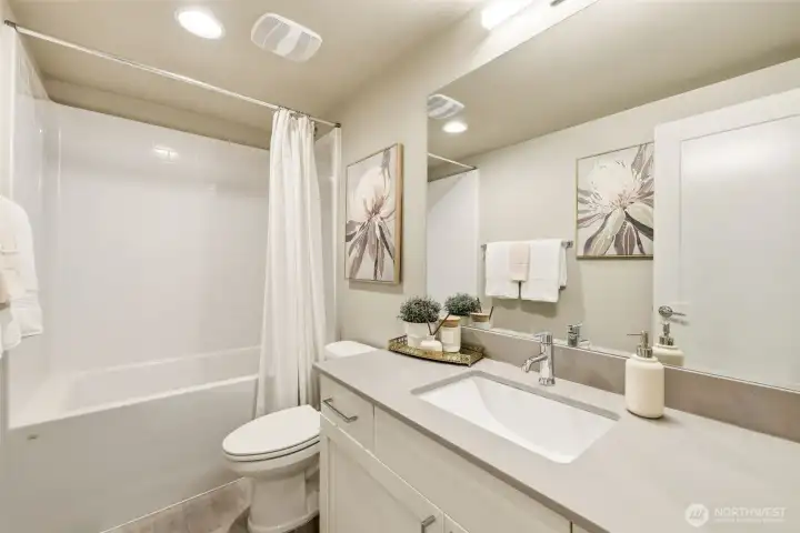 Full common bathroom featuring a bathtub and timeless design