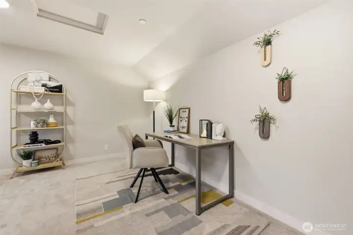 Upstairs bonus room staged as a home office, perfect for today’s flexible lifestyle
