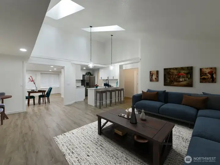 Staged living room showing the Counter area in Kitchen. Laminate Flooring throughout.