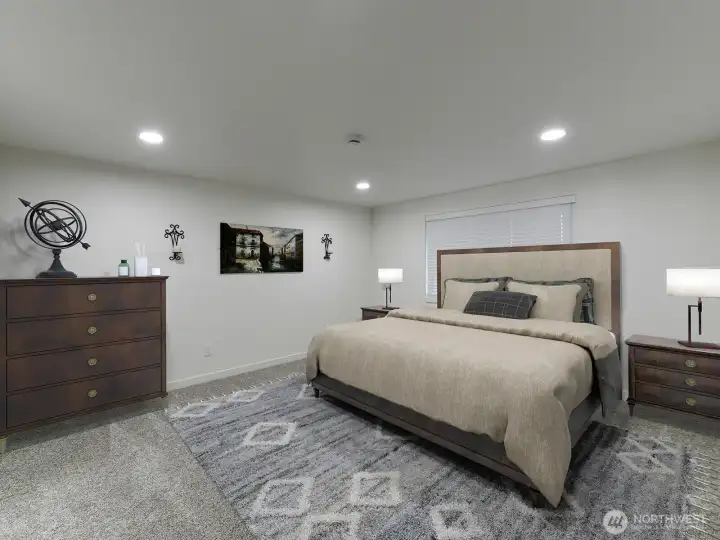 Primary Bedroom Staged. Recessed light. New carpets.