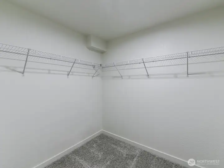 Attached Primary closet with white wire racks.