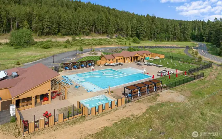 Nelson Farm Pool, expansive outdoor pool, lounge seating, and sun deck, family-friendly atmosphere.