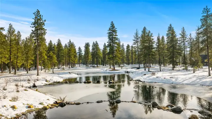 In winter, Nelson Lakes transforms into a peaceful snow-covered landscape within Suncadia Resort's Nelson Preserve.