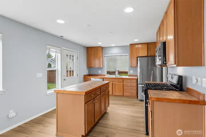 Stainless appliances and a gas range.