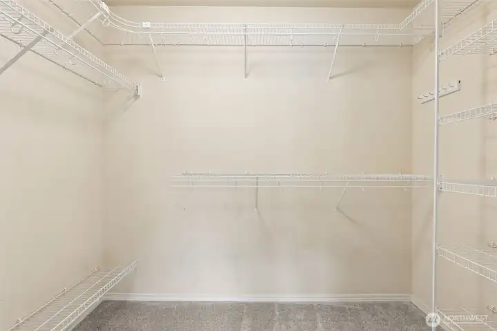 Primary closet has lots of storage.