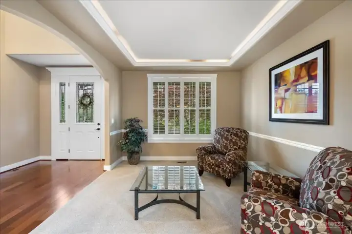 Subtle overhead lighting throughout the home creates a warm, inviting ambiance, while the stunning wood blinds add timeless elegance and style.