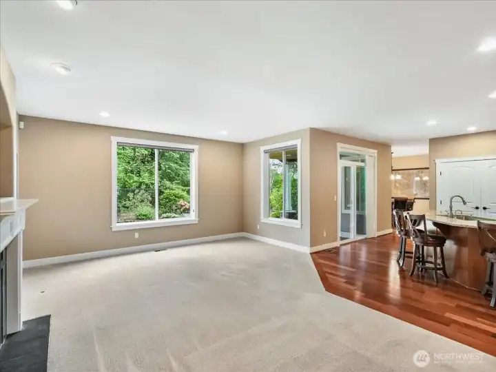 Now you can see how open the kitchen is to the spacious family room with a beautiful gas fireplace and mantle.