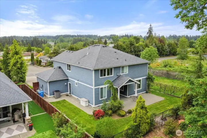 A view of the back of the home and how the lot is situated. It really is quite private with beautiful cement walkways around the side of the home.