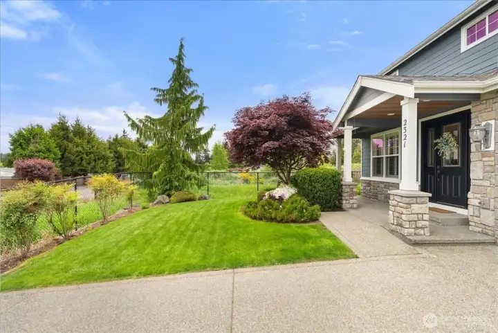 Front yard and covered front porch.