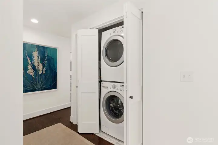 Laundry in hall shared by three bathrooms