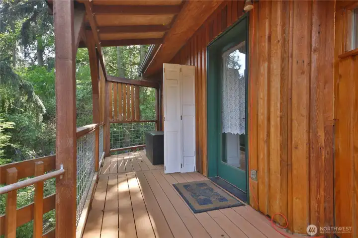 Enter to the living room from the wraparound deck.