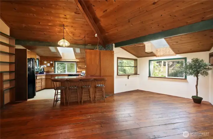 Dine under the skylight with space for a large table off of the kitchen.