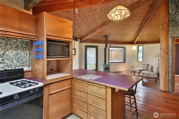 The kitchen looks into the main living area.
