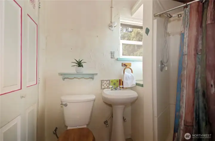 3/4 bathroom on the main level of the home, off of the living room.