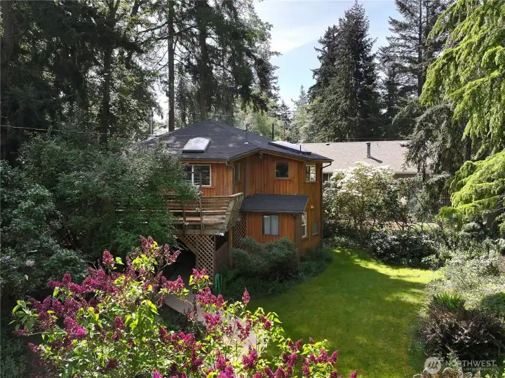 Mature landscaping surrounds the home.
