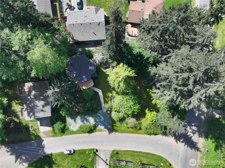 Aerial photo showing the skylights, accessible path to the home, and wraparound deck.