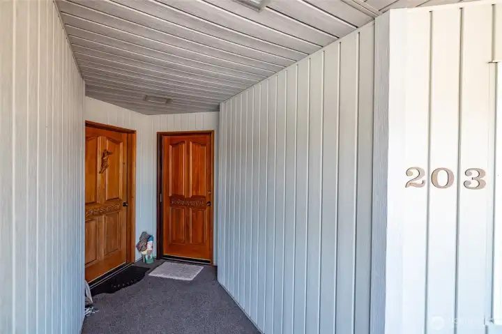 Unit 203 is the door to the right