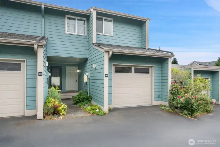 Enjoy easy Bainbridge Island living in this thoughtfully updated condominium just minutes from Winslow, the Seattle ferry, shopping, dining and neighborhood parks. Filled with natural light, the open main level offers a welcoming living room with a wood-burning fireplace and an updated kitchen featuring stainless steel appliances, solid surface countertops, abundant cabinetry and breakfast bar seating. Upstairs are two spacious bedrooms, an updated full bath, convenient laundry and partial water and territorial views. Relax on the private deck overlooking mature landscaping or take advantage of the community pool and clubhouse. An attached one-car garage provides additional storage and convenience, making this move-in ready home an exceptional opportunity in one of Bainbridge Island's most desirable locations.