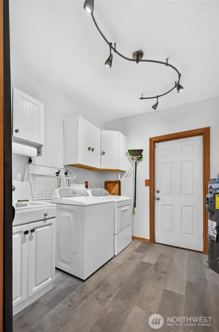 Laundry room with new flooring & new water heater! Laundry room with new flooring & new water heater!