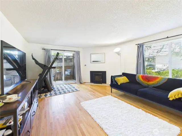 Living room to deck. Hardwood floors.