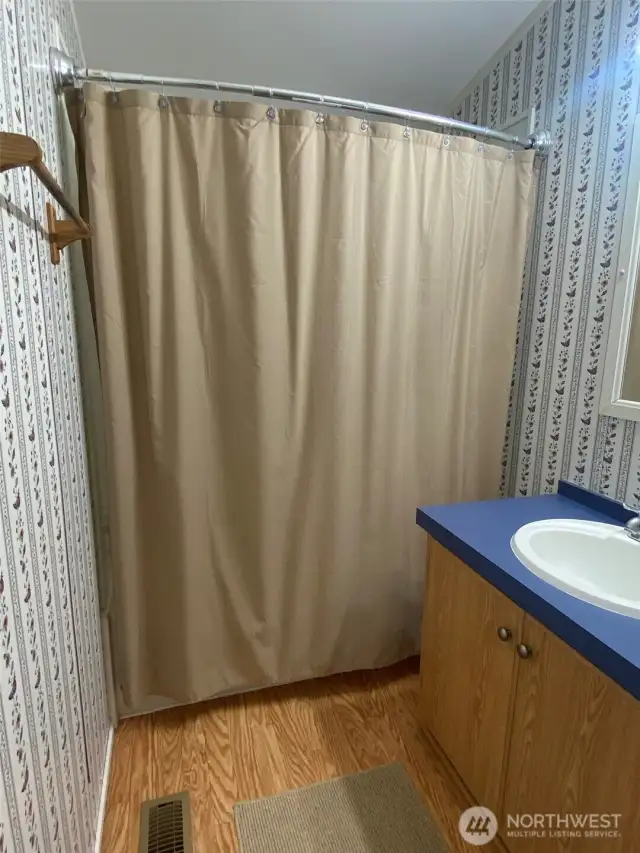 Curved shower curtain