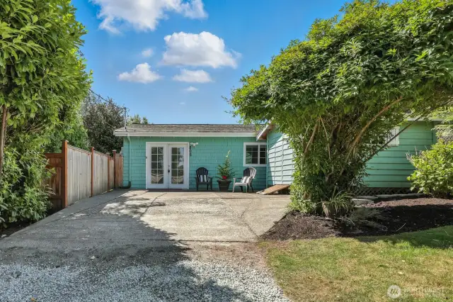 Private driveway & french doors welcome you to this tidy home